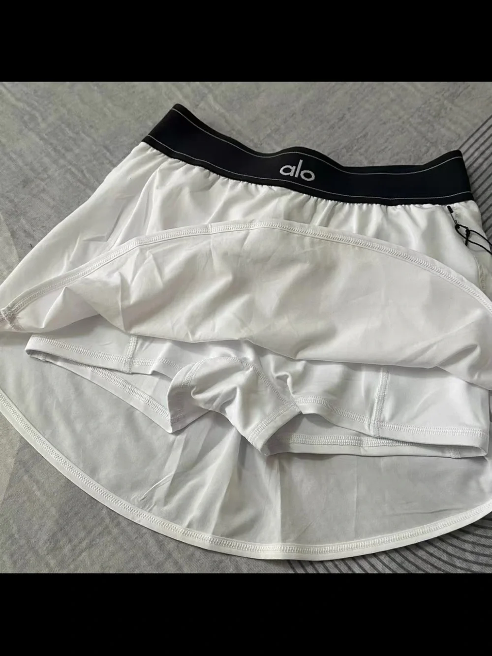 ALO Yoga White Tennis Skirt with Black Elastic Waistband